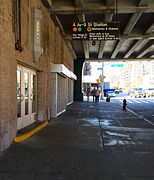 One of two entrances under the bridge to the IND Culver Line platforms