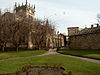 An impressive stone church with a central pinnacled tower