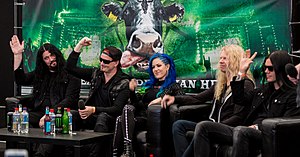Arch Enemy in 2016 (from left to right: Sharlee D'Angelo, Michael Amott, Alissa White-Gluz, Jeff Loomis, and Daniel Erlandsson).