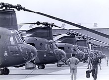 Black and white photo of a large number of helicopters on the ground