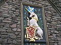 Scottish unicorn, flag and shield carved at Holyrood Palace, Edinburgh