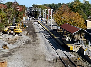 A railway station with a single platform viewed from slightly above