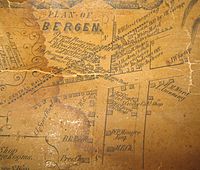 An old map on yellowed paper headlined "Plan of Bergen" showing the businesses there, the roads and the railroad line