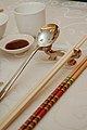 Image 59Photo showing serving chopsticks (gongkuai) on the far right, personal chopsticks (putongkuai) in the middle, and a spoon. Serving chopsticks are usually more ornate than the personal ones. (from Chinese culture)