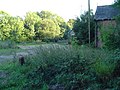 The centre of the Whitwell Station Site; with the goods shed in the centre background, and the rear of the station, front right.