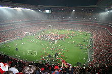 Hundreds of Benfica supporters invade the Estádio da Luz pitch to celebrate the league title in 2005.