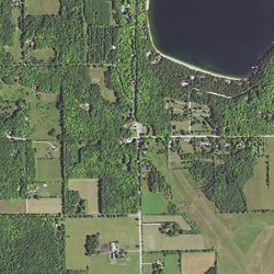 Main Road (center) runs north–south and forms a T intersection with Jackson Harbor Road running east. County Trunk Highway W (CTH-W) coincides with Little Lake Road (top left), which runs east–west. Little Lake Road turns south and ends with a junction at Main Road. At the southeast terminus of Little Lake Road, CTH-W continues, following south along Main Road. Washington Harbor is at the top right.