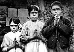 Lúcia Santos (middle) with Francisco and Jacinta Marto