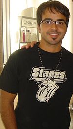 A Latin American man wearing a black t-shirt