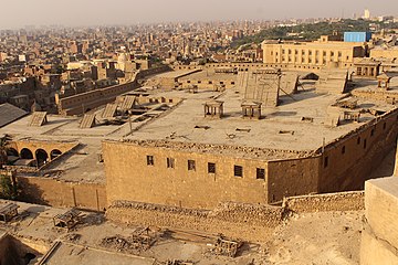 Windcatchers and shuksheika roofs shading narrow airshaft courtyards, Cairo Citadel