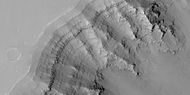 Close view of layers in Louros Valles, as seen by HiRISE under HiWish program Note this is an enlargement of a previous image.