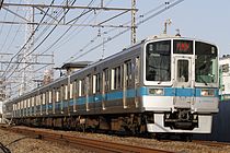 クヤ31形を牽引する1000形1051×4 （2015年2月15日 読売ランド前駅 - 生田駅）