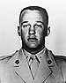 A black and white image showing the head and shoulders of Reasoner in his military dress uniform.