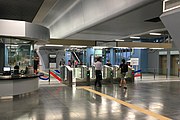 Commuters entering the fare gates from Entrance B of the station.