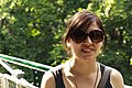 A young woman wearing outsized sunglasses while visiting Zoo Vienna, Austria.