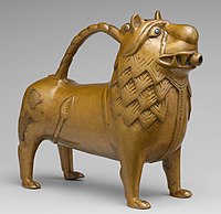 Aquamanile in the form of a lion, 12th century, made of copper alloy with glass inlays, overall: 19.5 x 21.9 x 8.7 cm, in the Metropolitan Museum of Art (New York City)