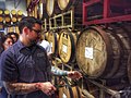 Image 23A beer sommelier tapping a barrel for a taste at Nebraska Brewing Company (from Craft beer)