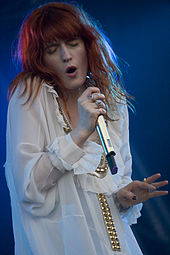 Colour photograph of Florence Welch performing live in 2010.