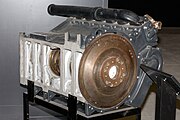 Maybach HL210 P45. The entire engine block is a single aluminium alloy casting from the top of the cylinders to the bottom of the crankcase. Photo shows underside of crankcase, with part of tunnel crankshaft. The crank webs are circular, supported by outsize bearings which locate into machined housings. Note centre bearing with groove (partially shown) for semi-circular retaining rings.[83] The flat bottom cover (removed) would be bolted to the underside of the crankcase.