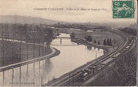 La Meuse à Commercy vers 1912, longée d'un côté par la ligne de Paris-Est à Strasbourg-Ville et de l'autre par le canal de l'Est.