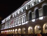 The facade at night
