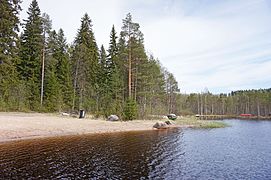 A beach by the lake Vesankajärvi.