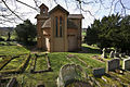 Chapel, showing in foreground terracotta grave marker made in the Compton pottery