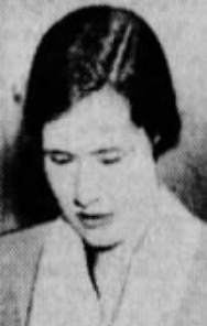 Clare S. Spackman, a young white woman with fair skin and dark hair, gaze cast downward