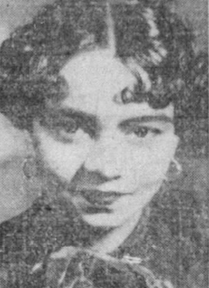 blurry, black-and-white image of a smiling young African American woman with dark glossy hair parted and curled
