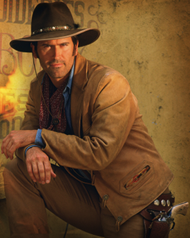 An image of a cowboy, leaning with his arms on his right knee. A revolver pistol is holstered on his left hip.