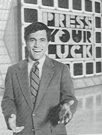 A black-and-white picture of game show host Peter Tomarken.