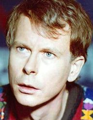 Publicity shot in dramatic style, of young, fresh-faced actor, looking upwards and apparently speaking. He has fairly short, auburn hair, in boyish fashion.