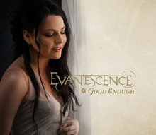 A woman with black hair and white dress is looking forward. Below her image, the word "Evanescence" is written with yellow letters. In front of her, the words "Good Enough" are written with yellow letters.