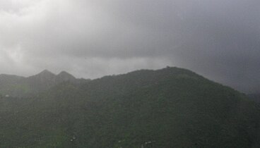 Cerro Las Tetas (to the left) from farther in the mountain range