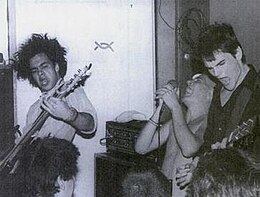 Embrace at Food for Thought in July 1985. From left to right are Chris Bald, Ian MacKaye, and Mike Hampton. Band's drummer, Ivor Hanson, is out of frame.