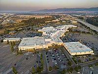 Aerial view of the mall and surrounding skyline taken during the fall as the sun is setting behind the camera