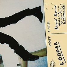Two crooked legs appear from the left with a post card reading "David Bowie" and "Lodger" on the right.