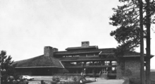 Screenshot of a digitized ROMA brochure. Image shows the Sunriver Lodge, a multi-level brick building with large windows, three chimneys, and layered roof lines. The photograph is in black and white.