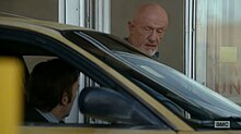 Saul Goodman argues with parking attendant Mike Ehrmantraut