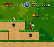 This screenshot shows Mario riding Yoshi during the first level of the game. The scenery shows a jungle environment with floating blocks scattered in the air. The interface displayed around the corners shows the number of lives the player has, the Dragon Coins collected, the player's stored power-up, the level's remaining time, the player's number of coins, and the total score of the player.