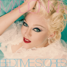 A woman laying down on a bed, wearing heavy makeup with her hand to her head, with "Madonna" written in pink capital lettters, while "Bedtime Stories" is written in sky-blue capital letters.