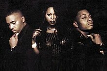 Promotional shot of The Firm in 1997, left to right: Nas, Foxy Brown and AZ