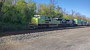 Norfolk Southern 1072, an EMD SD70ACe painted in Illinois Terminal colors, leads an intermodal train through Lewistown, Pennsylvania