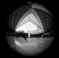 An image of the Louvre museum entry taken with the 7.5 mm f/5.6 circular fisheye Nikkor lens
