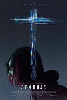 "US theatrical release poster": A man's face is covered by a glitch-style cross.