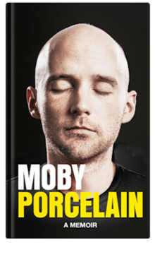 Moby's face on a black background