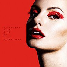 The cover for "Give Me Your Everything" features Stan standing in front of a red backdrop. She wears red make-up, with the name of the song being shown on her right.