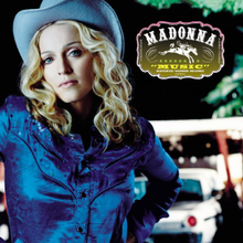 Madonna wearing a blue cowboy outfit and hat. On the right, a box in the shape of a cowboy buckle contains the text: Madonna, Music, Maverick/Warner Bros.