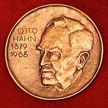 A medallion with an embossed image of Otto Hahn