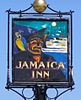 Pub sign showing a man with a patch on his left eye, a parrot on his right shoulder, and the words "Jamaica Inn"